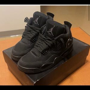Black cat Jordan 4s